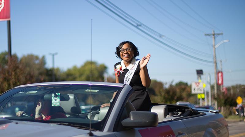 Celeste waves in homecoming parade